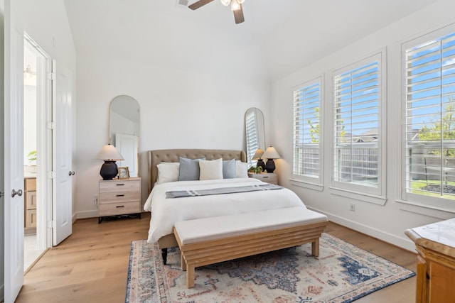 21514 Sunny Riverbank Cir, Cypress, TX 77433 - bedroom with light wood-style floors, a ceiling fan, and lofted ceiling