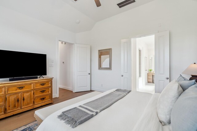 21514 Sunny Riverbank Cir, Cypress, TX 77433 - bedroom with light wood finished floors, lofted ceiling, and ceiling fan