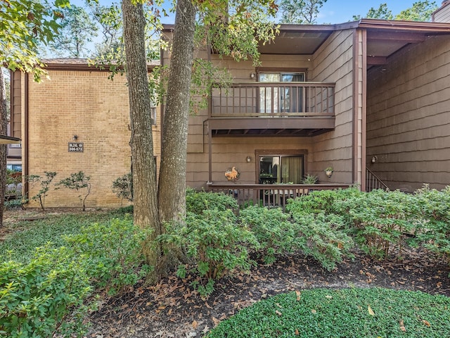11711 Memorial Dr Unit 570, Houston, TX 77024 - rear view of house featuring a balcony