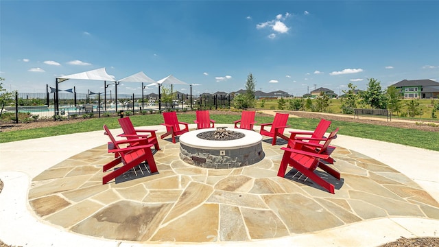 9227 Heckenberg Arbor Ln, Cypress, TX 77433 - view of patio featuring a fire pit