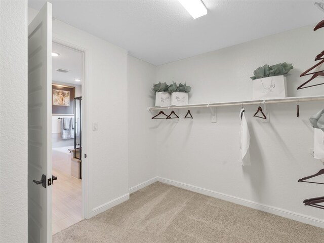9227 Heckenberg Arbor Ln, Cypress, TX 77433 - walk in closet with carpet flooring