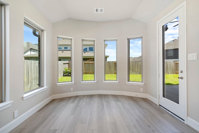 916 Wormwood Dr, League City, TX 77573 - unfurnished sunroom with vaulted ceiling, wood finished floors, and healthy amount of natural light