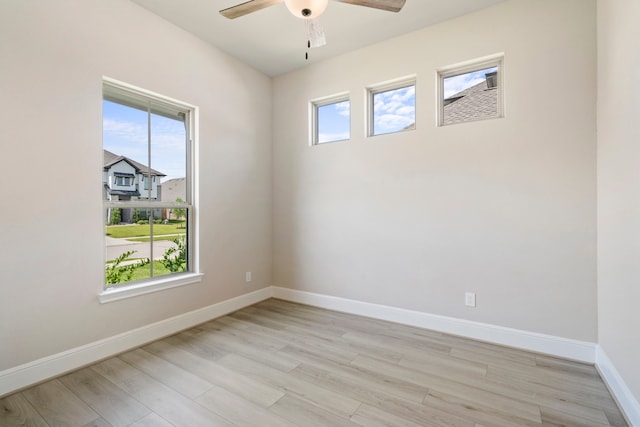 916 Wormwood Dr, League City, TX 77573 - empty room featuring healthy amount of natural light, a ceiling fan, and light wood finished floors