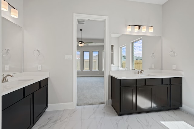916 Wormwood Dr, League City, TX 77573 - full bath with a ceiling fan, marble finish flooring, and two vanities