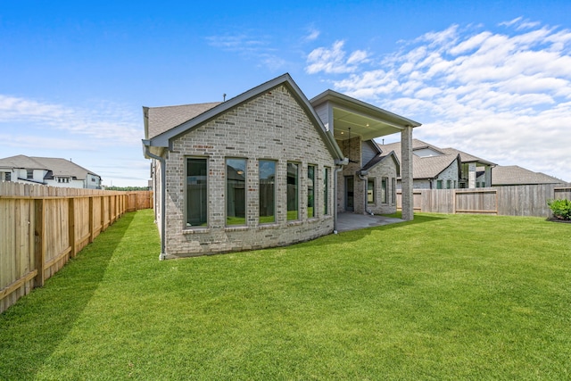 916 Wormwood Dr, League City, TX 77573 - back of house featuring brick siding, a fenced backyard, and a patio