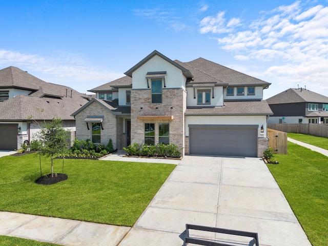916 Wormwood Dr, League City, TX 77573 - view of front facade with stucco siding, driveway, a shingled roof, an attached garage, and brick siding