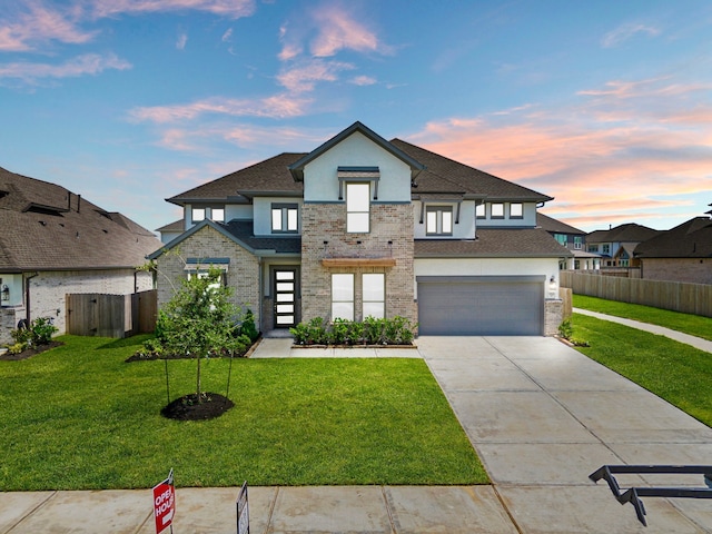 916 Wormwood Dr, League City, TX 77573 - contemporary home with stucco siding, driveway, an attached garage, and roof with shingles