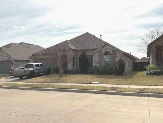 1813 Huntsman Way, Forney, TX 75126 - view of front of house with concrete driveway and an attached garage