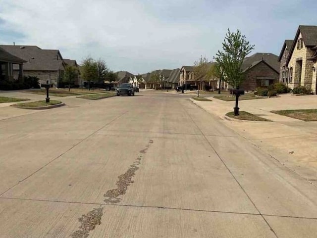 1813 Huntsman Way, Forney, TX 75126 - view of concrete street with a residential view, sidewalks, and curbs