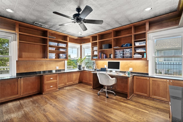 208 W 34th St, Houston, TX 77018 - home office featuring built in desk, an ornate ceiling, ceiling fan, wood finished floors, and healthy amount of natural light