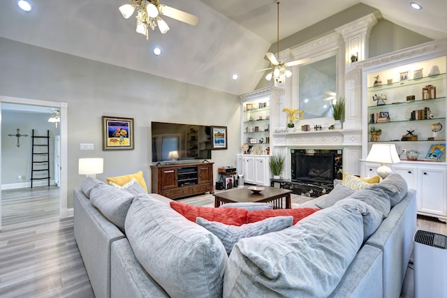 1950 Country Club Rd, Brenham, TX 77833 - living area with ceiling fan, vaulted ceiling, light wood-type flooring, recessed lighting, and built in shelves
