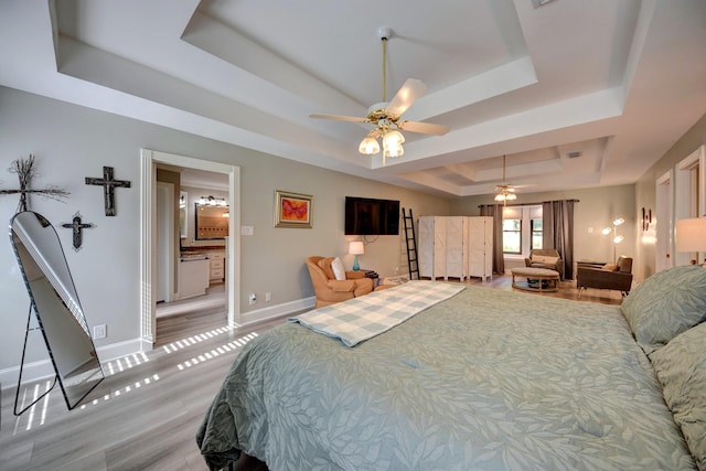 1950 Country Club Rd, Brenham, TX 77833 - bedroom with a raised ceiling and light wood-style flooring