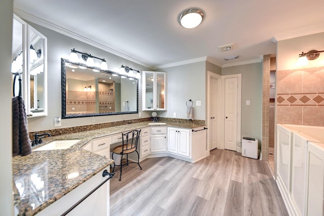 1950 Country Club Rd, Brenham, TX 77833 - bathroom featuring vanity, ornamental molding, wood finished floors, and tiled shower