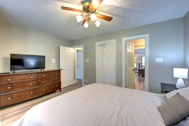 1950 Country Club Rd, Brenham, TX 77833 - bedroom with wood finished floors, a closet, and ceiling fan