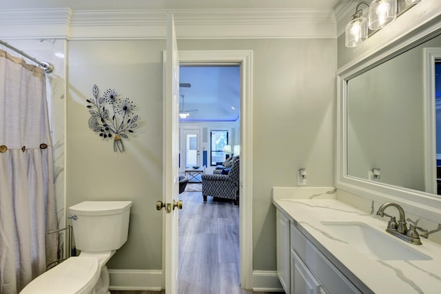 1950 Country Club Rd, Brenham, TX 77833 - ensuite bathroom with vanity, ornamental molding, wood finished floors, and a shower with shower curtain