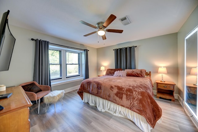 1950 Country Club Rd, Brenham, TX 77833 - bedroom featuring light wood finished floors and ceiling fan