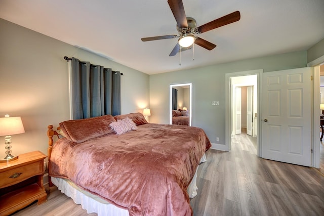 1950 Country Club Rd, Brenham, TX 77833 - bedroom with wood finished floors and a ceiling fan