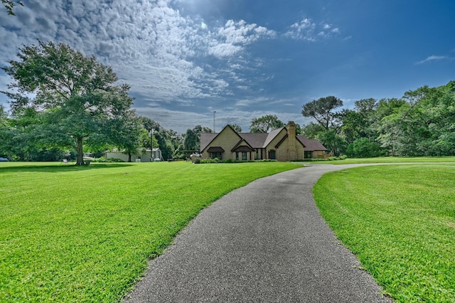1950 Country Club Rd, Brenham, TX 77833 - french country inspired facade with a front lawn and a chimney