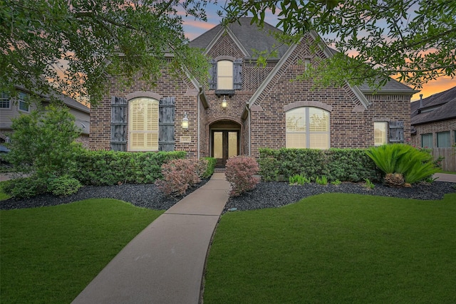 1107 Rymers Switch Ln, Friendswood, TX 77546 - view of front of property featuring brick siding, a front yard, and a shingled roof