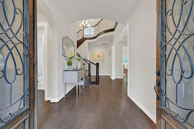 1107 Rymers Switch Ln, Friendswood, TX 77546 - foyer entrance with stairs, wood finished floors, arched walkways, and a chandelier