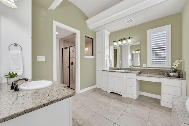 1107 Rymers Switch Ln, Friendswood, TX 77546 - full bath featuring a shower stall, two vanities, vaulted ceiling, tile patterned flooring, and a tub