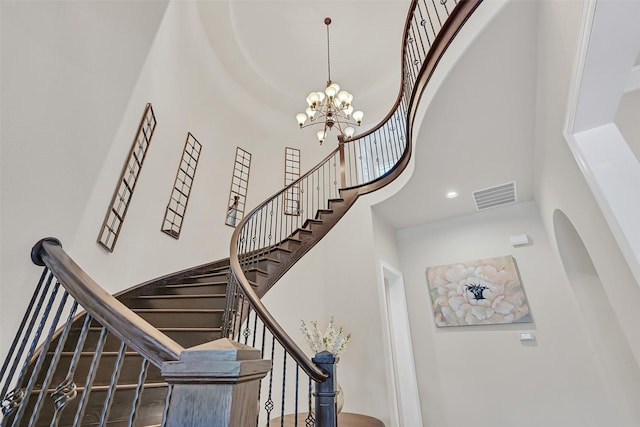 1107 Rymers Switch Ln, Friendswood, TX 77546 - stairway with a towering ceiling and a chandelier