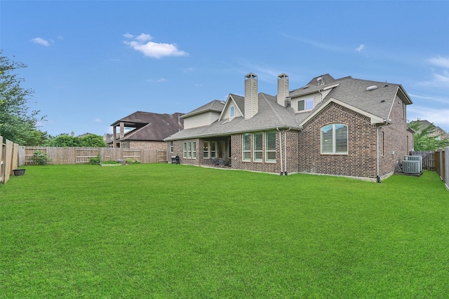 1107 Rymers Switch Ln, Friendswood, TX 77546 - back of property with brick siding, a fenced backyard, a chimney, and a shingled roof