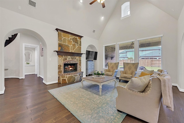 1107 Rymers Switch Ln, Friendswood, TX 77546 - living room with a ceiling fan, high vaulted ceiling, dark wood-style flooring, healthy amount of natural light, and arched walkways