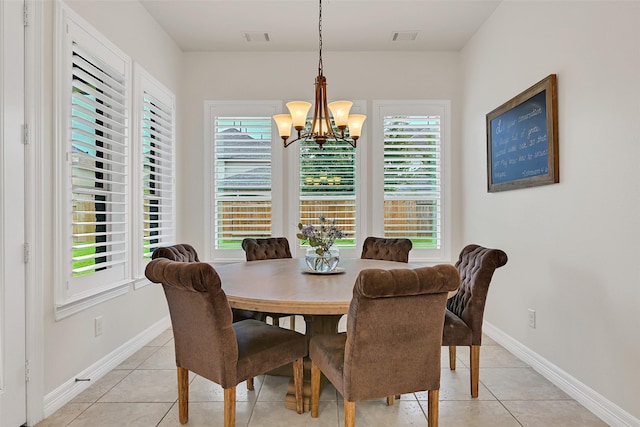 1107 Rymers Switch Ln, Friendswood, TX 77546 - dining area with a chandelier and light tile patterned flooring