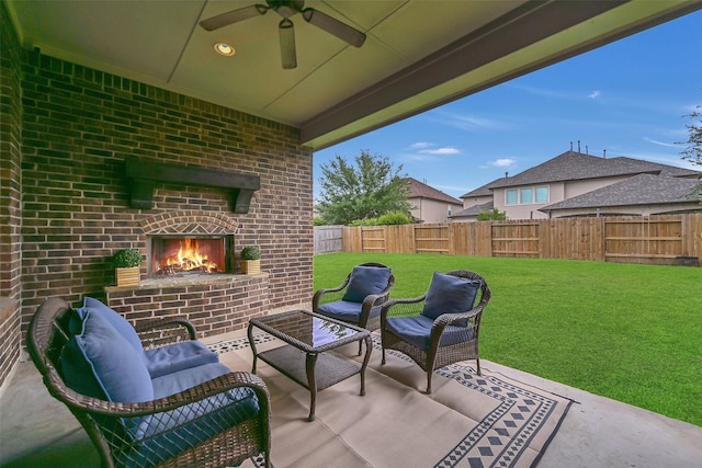 1107 Rymers Switch Ln, Friendswood, TX 77546 - fenced backyard with an outdoor living space with a fireplace, a patio area, and ceiling fan