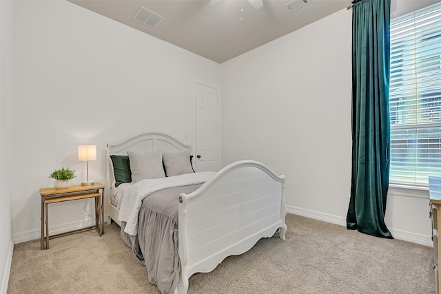 1107 Rymers Switch Ln, Friendswood, TX 77546 - bedroom with light carpet and ceiling fan
