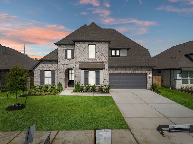 910 Hooks Trl, League City, TX 77573 - french country inspired facade featuring brick siding, a shingled roof, and concrete driveway