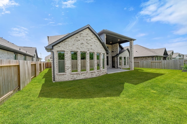 910 Hooks Trl, League City, TX 77573 - rear view of property with a fenced backyard, a patio area, and brick siding