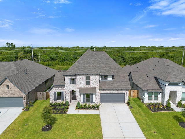 910 Hooks Trl, League City, TX 77573 - french country home with driveway, brick siding, a shingled roof, and an attached garage