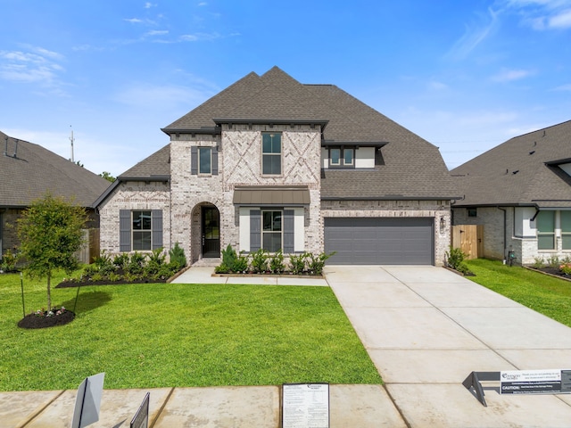910 Hooks Trl, League City, TX 77573 - french country inspired facade with brick siding, a shingled roof, and concrete driveway
