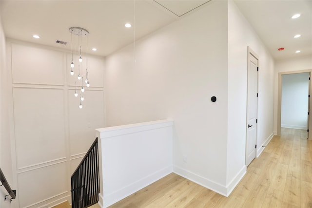 510 E 37th St, Houston, TX 77022 - corridor with recessed lighting, light wood finished floors, and attic access