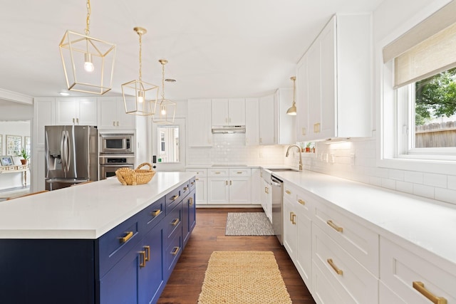 3006 Ann Arbor Dr, Houston, TX 77063 - kitchen with blue cabinets, appliances with stainless steel finishes, white cabinetry, light countertops, and recessed lighting