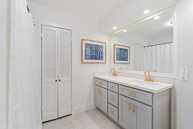 3006 Ann Arbor Dr, Houston, TX 77063 - full bath with tile patterned floors, double vanity, recessed lighting, and a closet