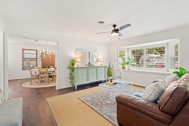 3006 Ann Arbor Dr, Houston, TX 77063 - living area featuring dark wood finished floors, a chandelier, and a ceiling fan