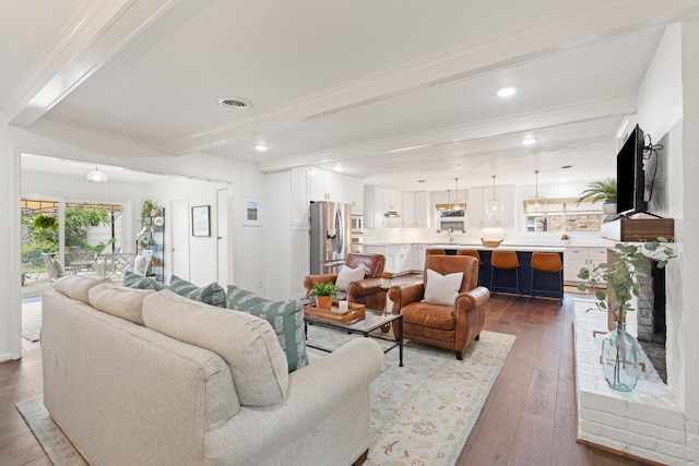3006 Ann Arbor Dr, Houston, TX 77063 - living area featuring beamed ceiling and dark wood-style flooring