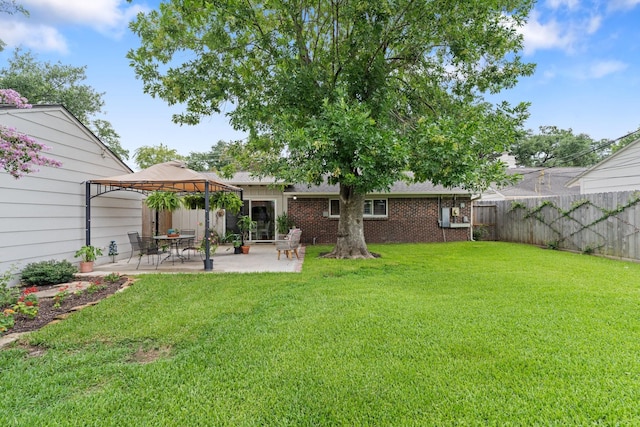 3006 Ann Arbor Dr, Houston, TX 77063 - rear view of property featuring a gazebo, a patio, a fenced backyard, and brick siding