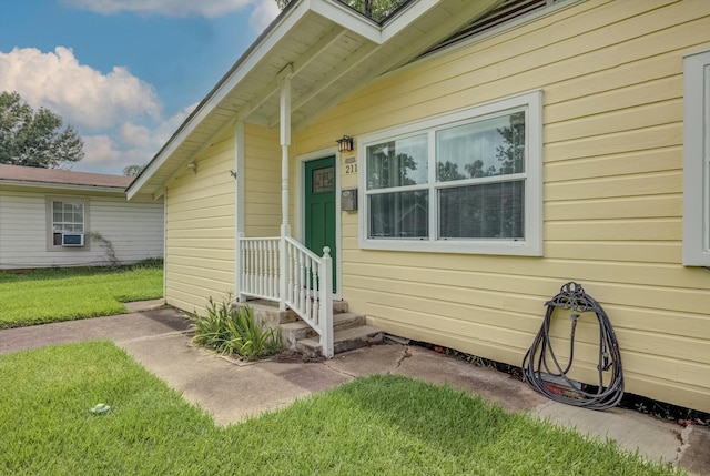 211 Magnolia St, Lake Jackson, TX 77566 - property entrance with a yard