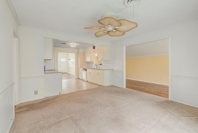 211 Magnolia St, Lake Jackson, TX 77566 - unfurnished living room with light carpet, ceiling fan, and crown molding