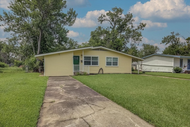 211 Magnolia St, Lake Jackson, TX 77566 - view of front of house with driveway and a front lawn