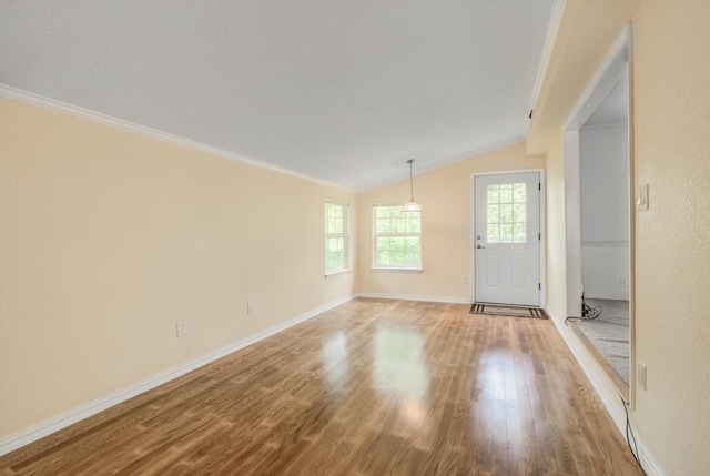 211 Magnolia St, Lake Jackson, TX 77566 - foyer with vaulted ceiling, light wood-style floors, and crown molding