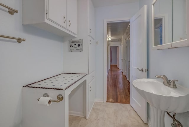 211 Magnolia St, Lake Jackson, TX 77566 - kitchen with white cabinetry and a sink