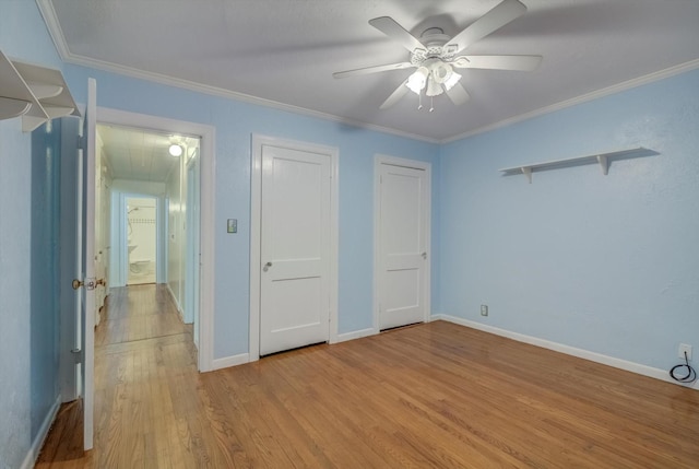 211 Magnolia St, Lake Jackson, TX 77566 - unfurnished bedroom with light wood-style flooring, crown molding, multiple closets, and a ceiling fan