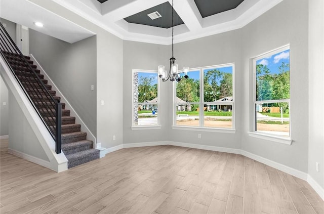 427 Rd 66111, Dayton, TX 77535 - unfurnished dining area featuring coffered ceiling, a chandelier, stairs, light wood-style floors, and beam ceiling