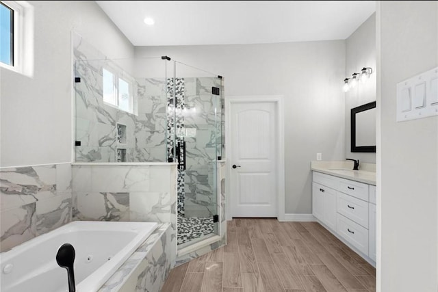 427 Rd 66111, Dayton, TX 77535 - bathroom featuring a marble finish shower, a tub with jets, vanity, and recessed lighting