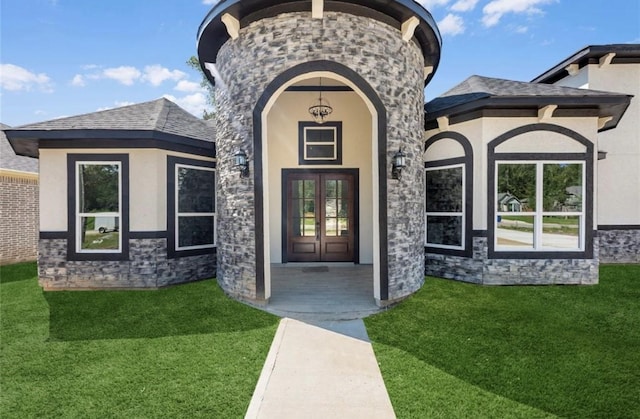 427 Rd 66111, Dayton, TX 77535 - entrance to property with stucco siding, a lawn, and french doors